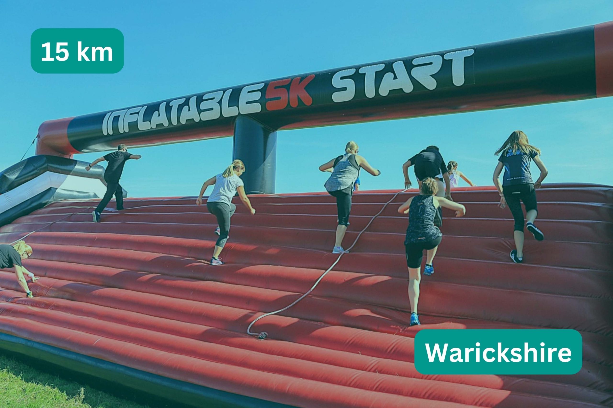 People running over inflatable obstical start line. Title text: 15km, Warickshire