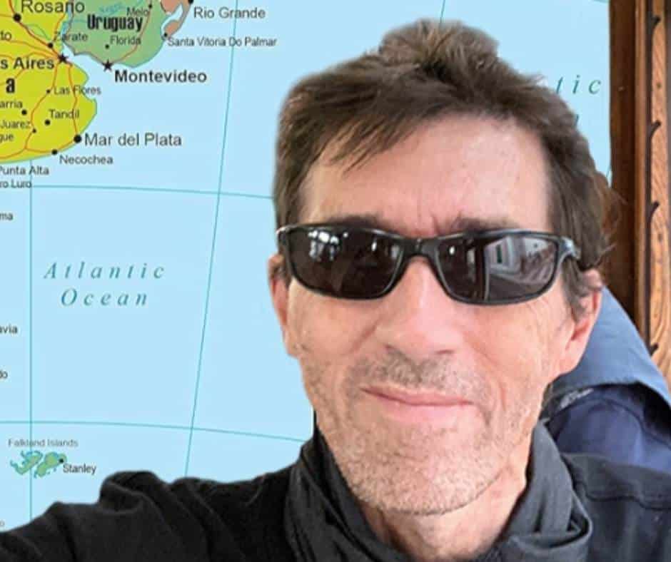 Picture of Steve standin in front of a map of south america