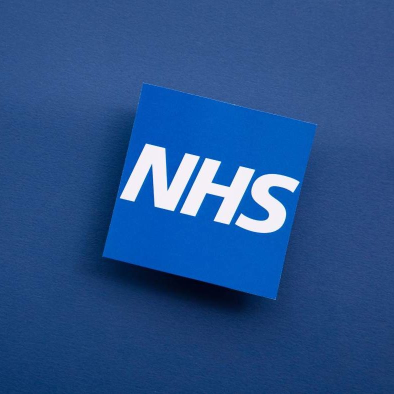 Blue background with NHS logo