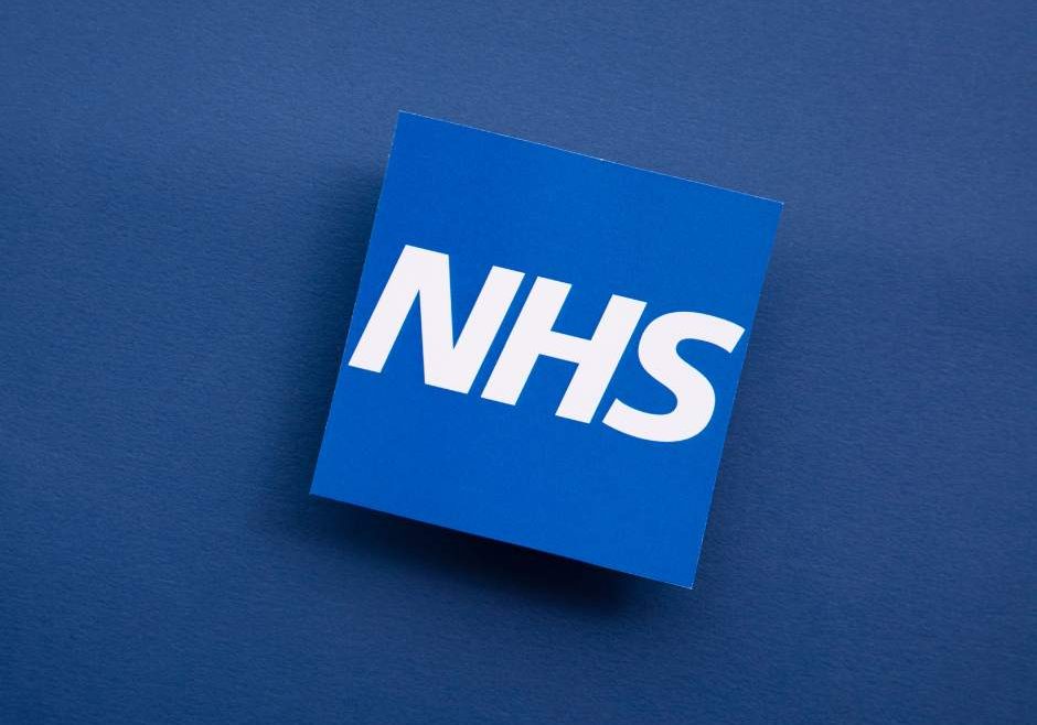 Blue background with NHS logo